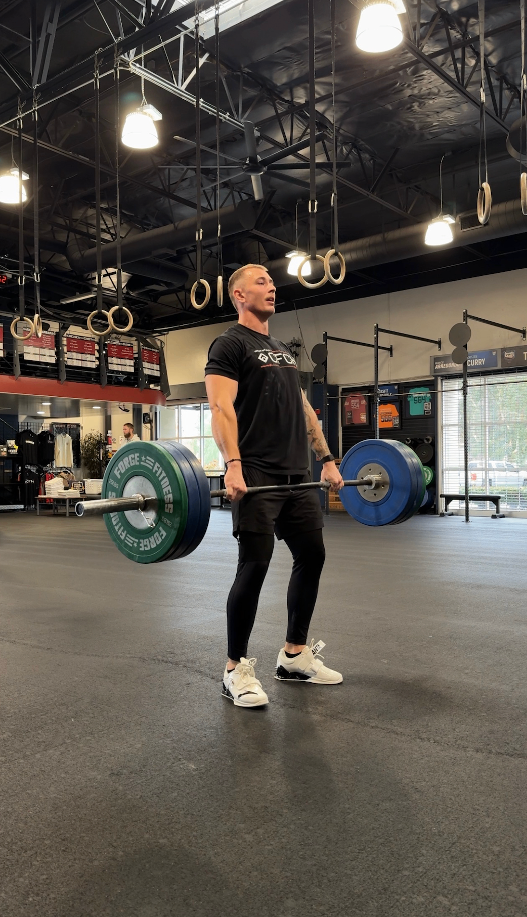 Athlete deadlifting heavy barbell
